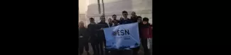 Group picture in the streets of Venice with the ESN Venezia flag