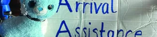 One of our signs for the arrival assistance with our mascot!