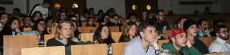 Group of international students watching a movie.