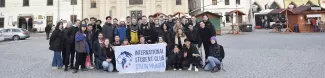 A group of international students standing on the main square.