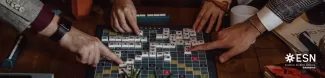 Set of hands of different people playing scrabble