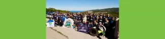 Group picture at the meeting point with all the participants, from the local community as well. Almost everyone wears the Plastic Free t-shirt and the local organisations show their flags