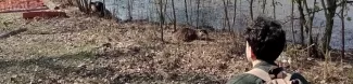 An erasmus student trying to interact with a nutria