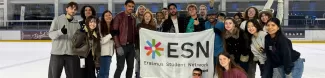 A group picture of international students and the volunteers at the ice skating rink