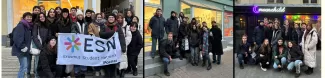 Event participants in front of three different second-hand stores.