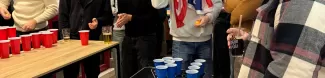 International students playing cup pong