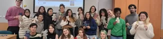 A group of students holding DIY teddy bears.