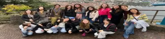 Group of international student standing on Como's landscape