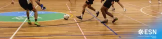 Group of international students playing futsal.