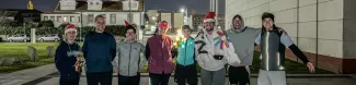 Photo group of the runners dressed in the XMas theme.