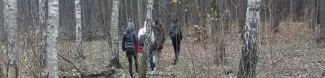 Participants waking through forest